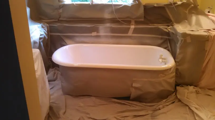 Same bathtub after professional refinishing with a smooth white gloss finish